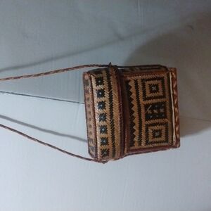 Crossbody woven lidded basket purse